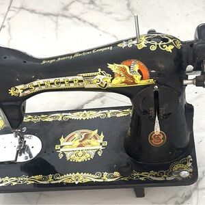 Vintage Sewing Machine with Black and Gold Design